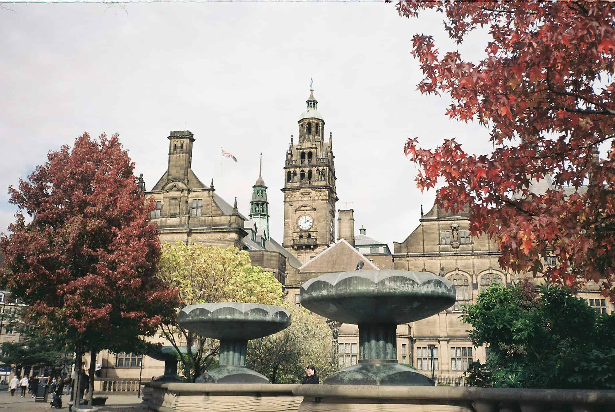 Brown and gray concrete fountain near building